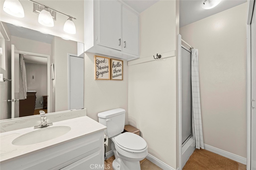 40069 East Newport Road Hemet, CA 92543 - Photo 28 of 64 a bathroom with a sink a toilet and shower