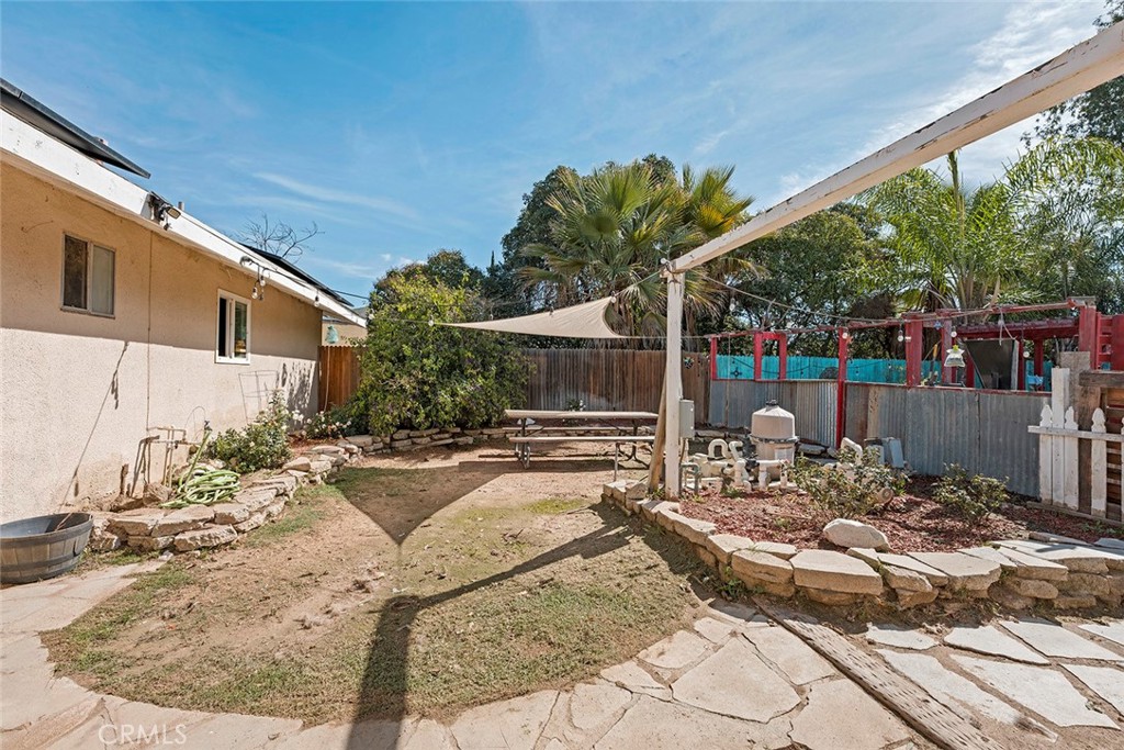 40069 East Newport Road Hemet, CA 92543 - Photo 32 of 64 a view of a backyard with sitting area