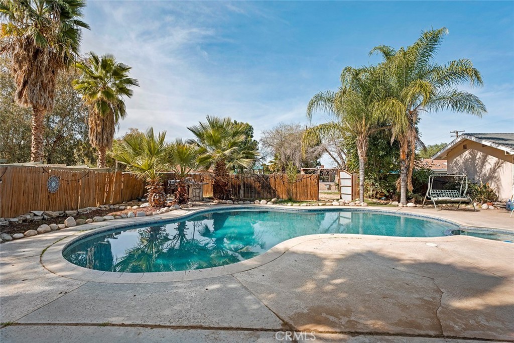 40069 East Newport Road Hemet, CA 92543 - Photo 38 of 64 a view of a swimming pool with a yard