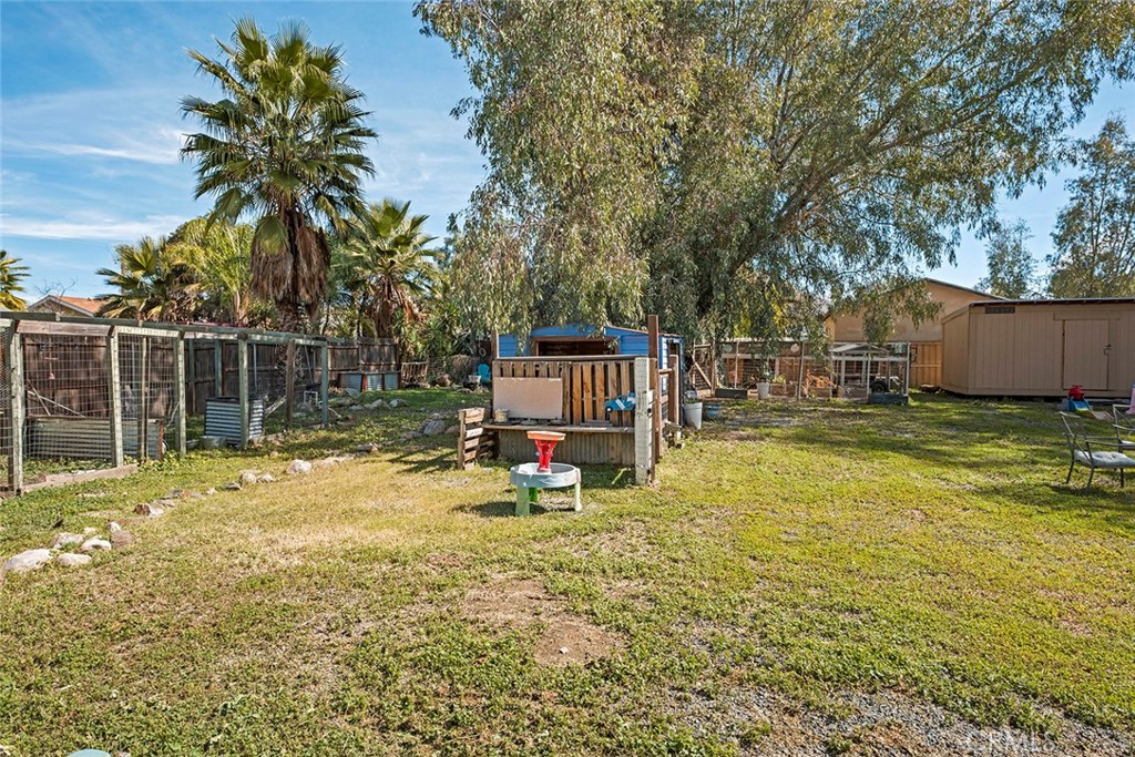 40069 East Newport Road Hemet, CA 92543 - Photo 40 of 64 a view of a house with a yard patio and swimming pool