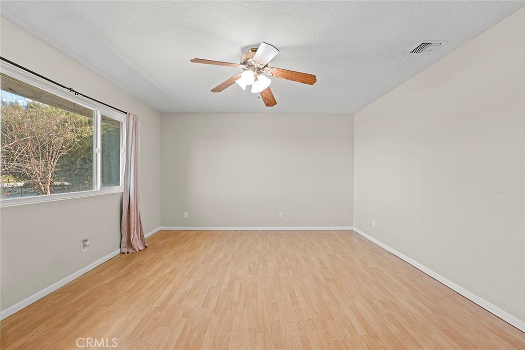 40069 East Newport Road Hemet, CA 92543 - Photo 4 of 64 wooden floor in an empty room with a window
