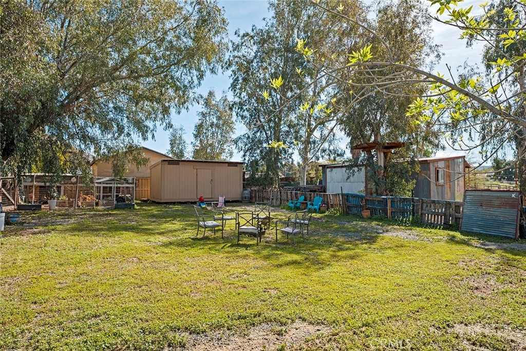 40069 East Newport Road Hemet, CA 92543 - Photo 41 of 64 a swimming pool covered with trees in the background