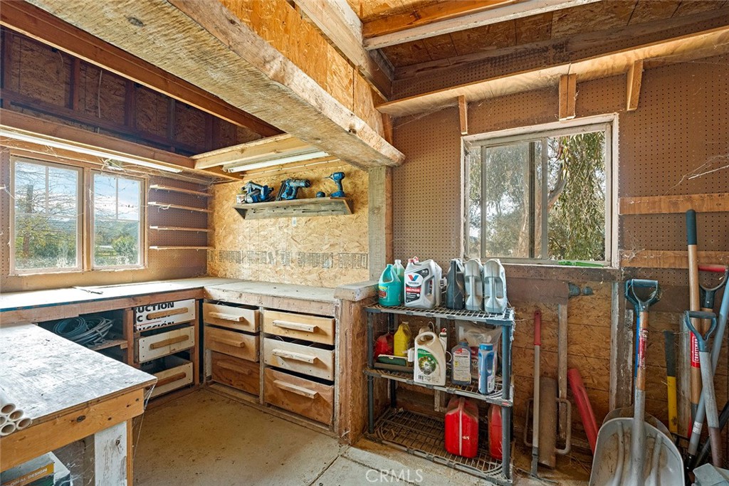 40069 East Newport Road Hemet, CA 92543 - Photo 46 of 64 a room with lots of wooden furniture and a window