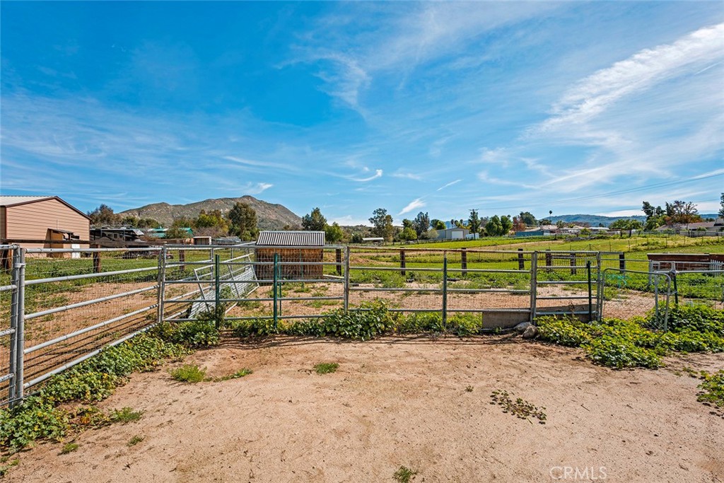 40069 East Newport Road Hemet, CA 92543 - Photo 49 of 64 a view of a yard with wooden fence