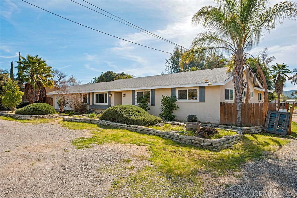 40069 East Newport Road Hemet, CA 92543 - Photo 50 of 64 a view of a house with swimming pool and sitting area