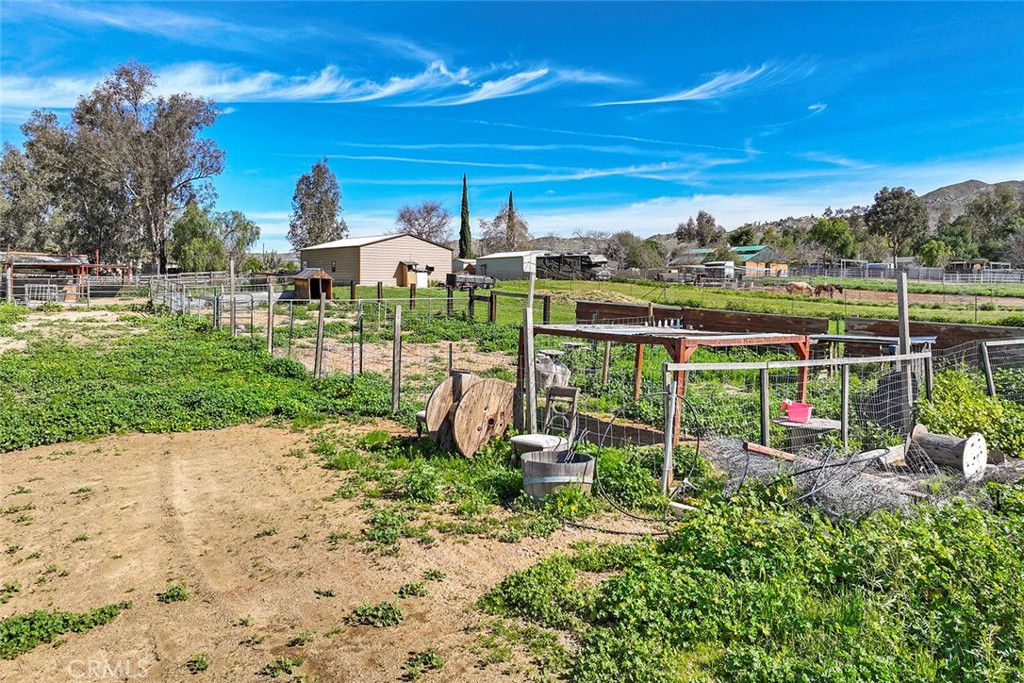 40069 East Newport Road Hemet, CA 92543 - Photo 58 of 64 a view of a chair and table in the garden