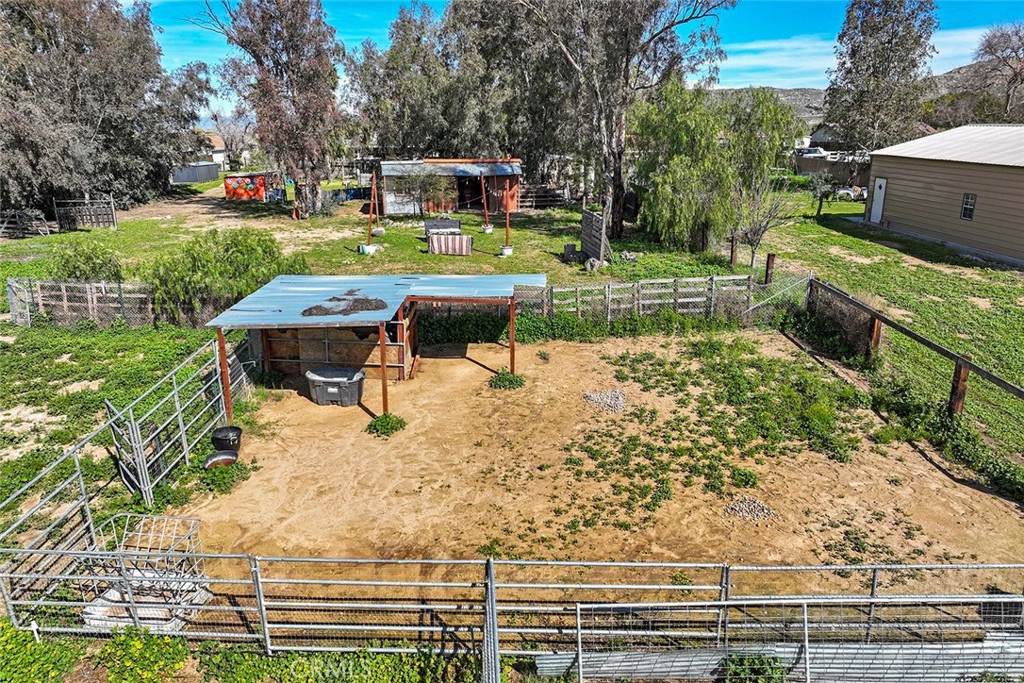 40069 East Newport Road Hemet, CA 92543 - Photo 60 of 64 a wooden bench sitting in the middle of a park