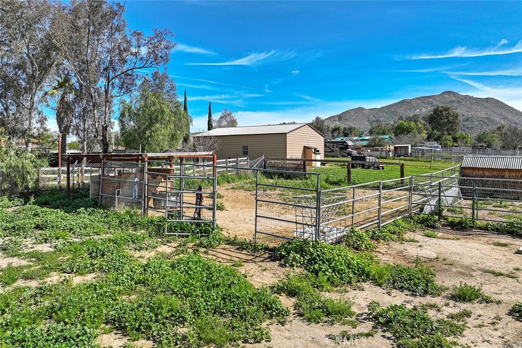 40069 East Newport Road Hemet, CA 92543 - Photo 62 of 64 a view of backyard with garden and deck