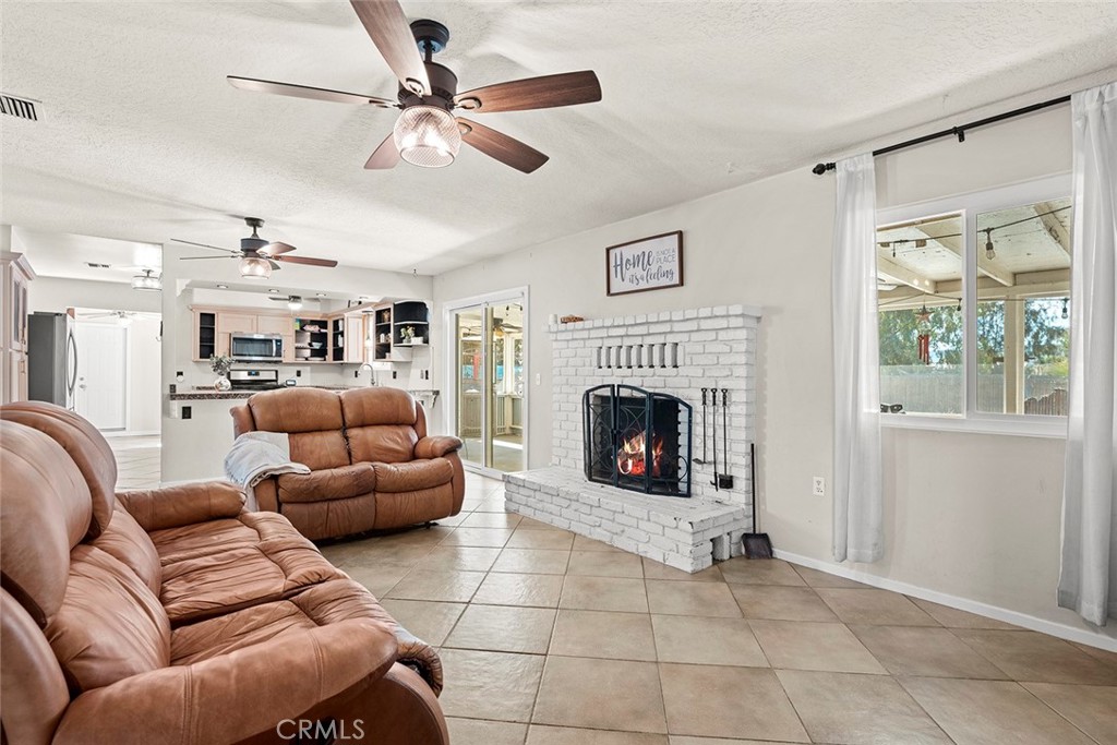 40069 East Newport Road Hemet, CA 92543 - Photo 7 of 64 a living room with furniture and a fireplace