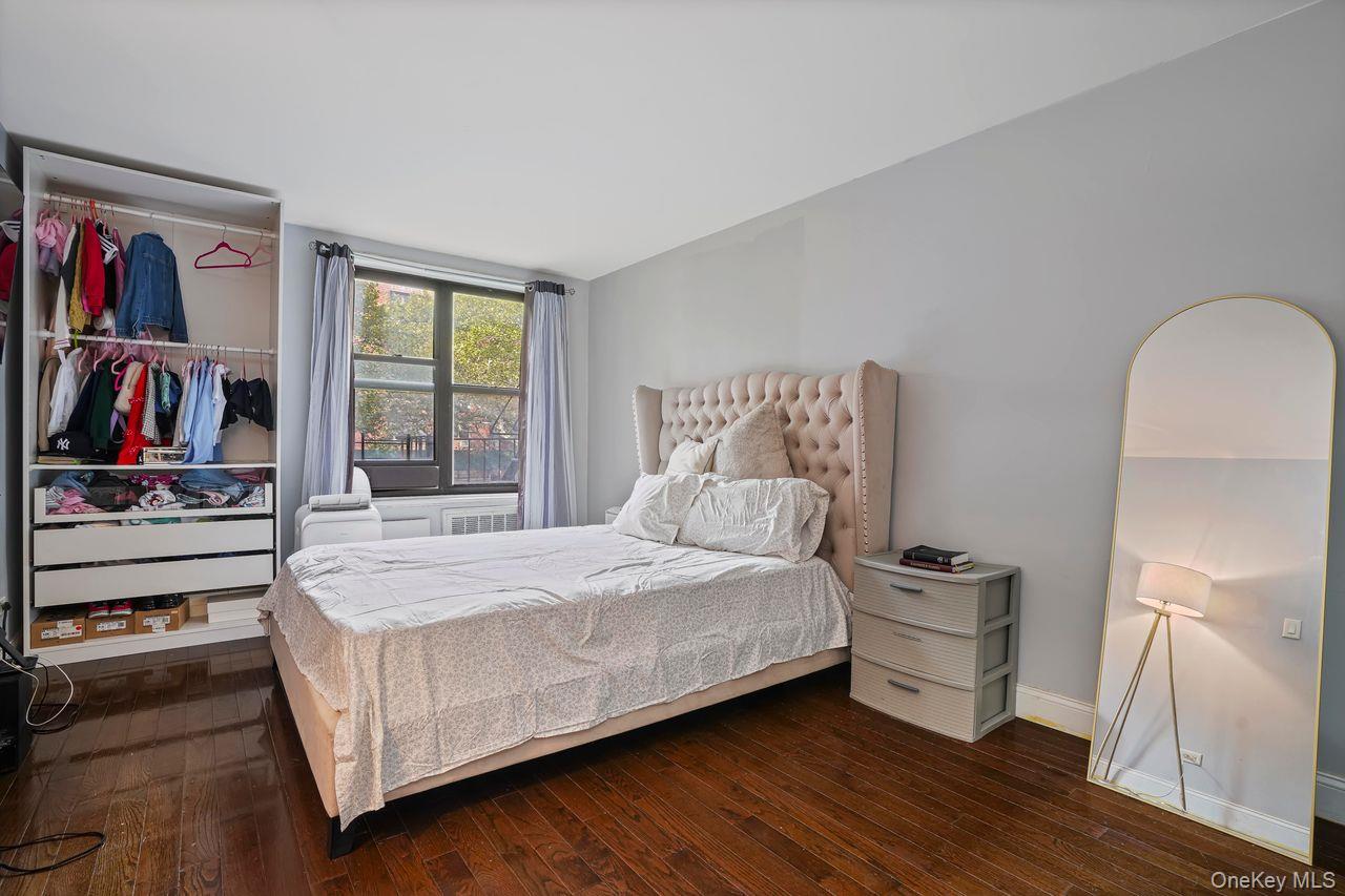 1190 East 53rd Street, Unit 2A Brooklyn, NY 11234 - Photo 6 of 11 a bed room with a bed and dresser