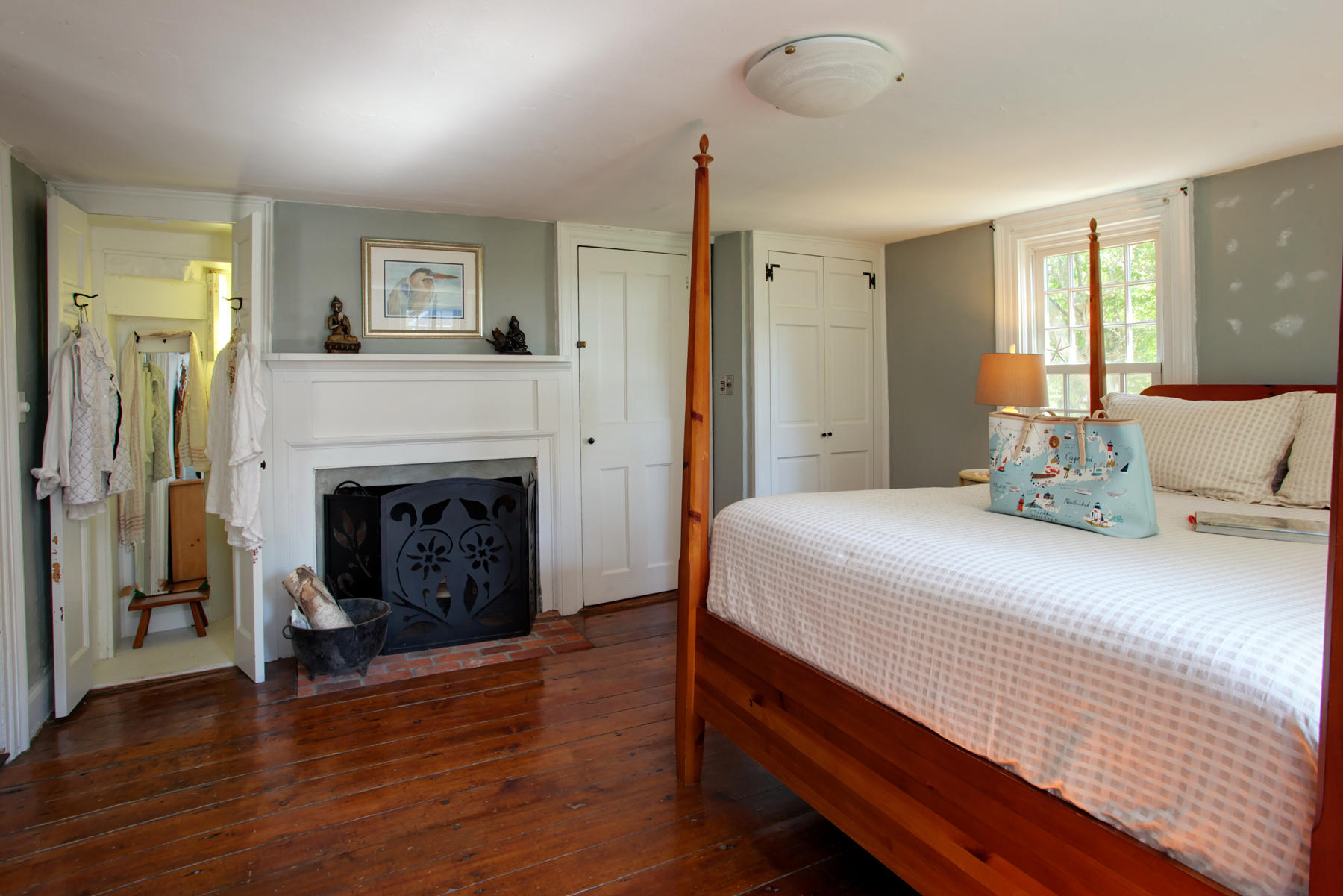 2 Plow Penny Road Bourne, MA 02532 - Photo 26 of 32 a bedroom with a bed and a fireplace