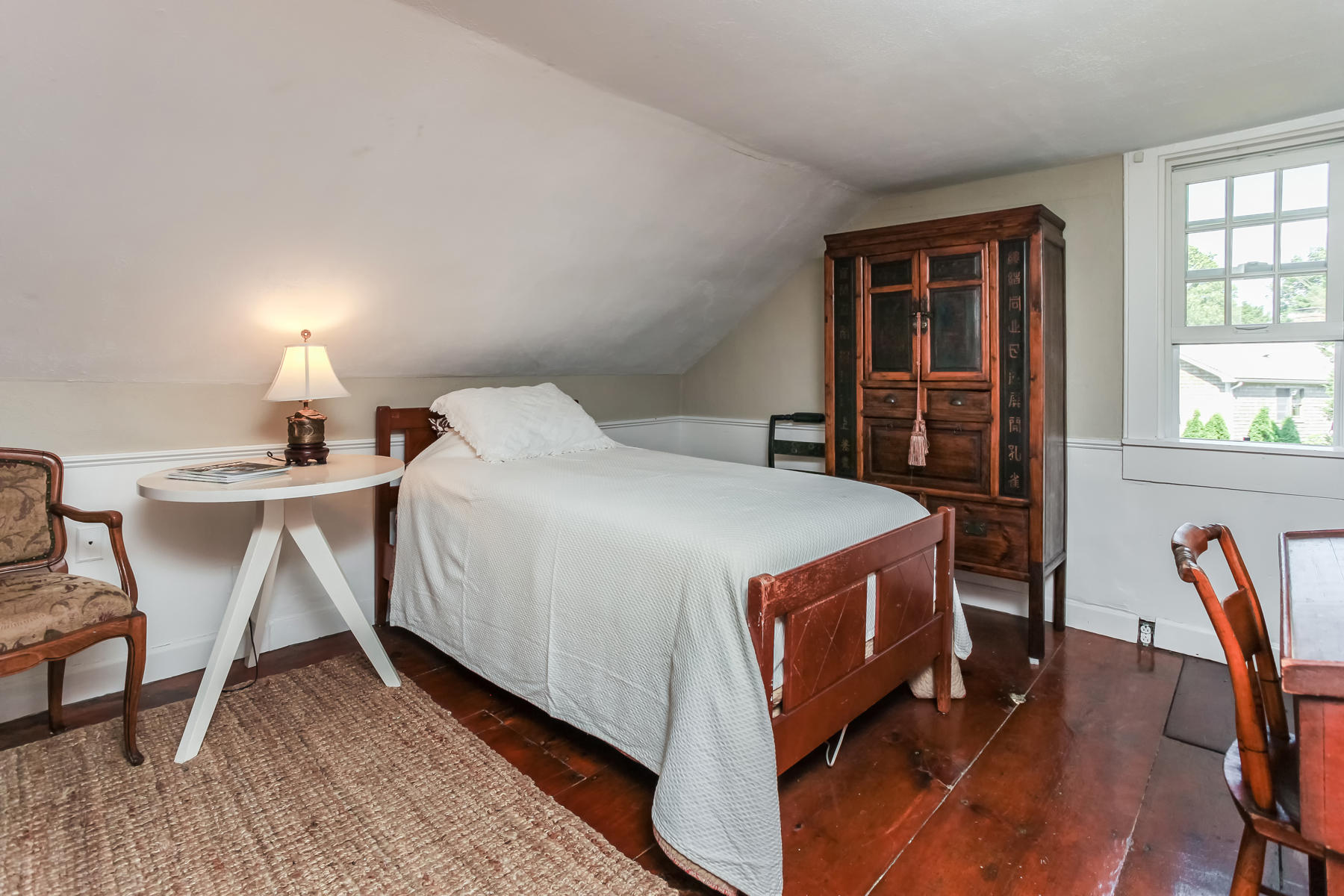 2 Plow Penny Road Bourne, MA 02532 - Photo 30 of 32 a bedroom with a bed a table and windows