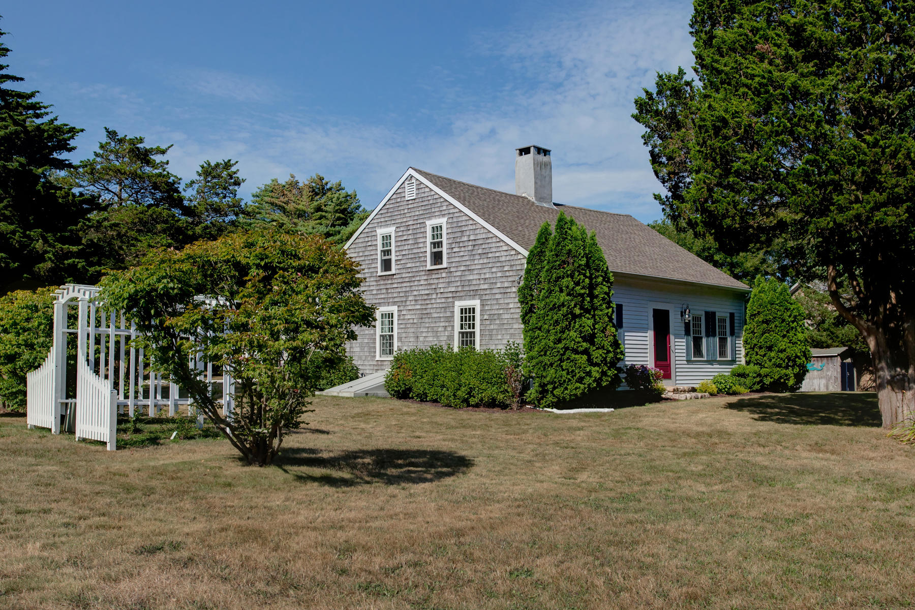 2 Plow Penny Road Bourne, MA 02532 - Photo 5 of 32 a front view of a house with a yard