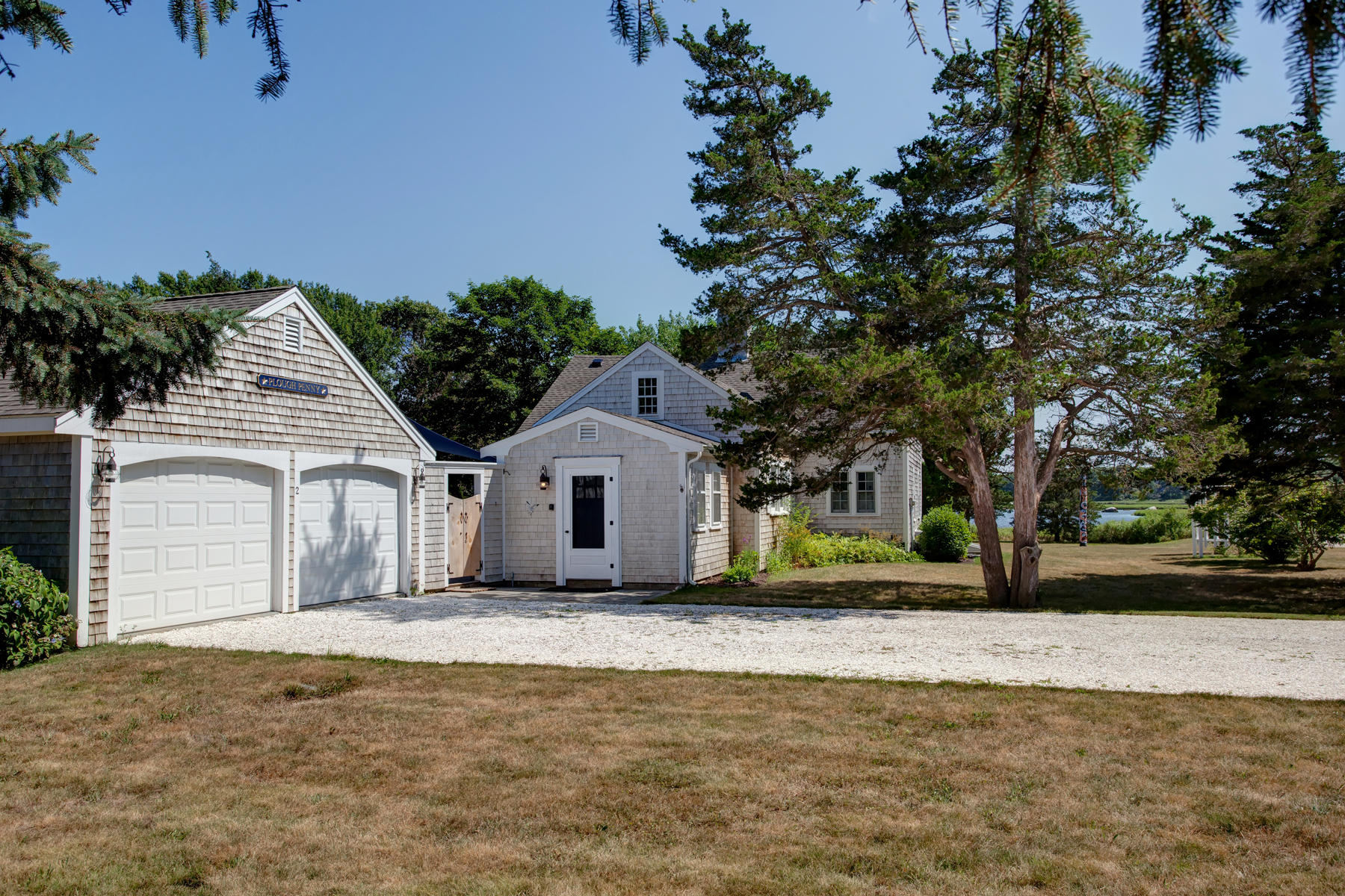 2 Plow Penny Road Bourne, MA 02532 - Photo 9 of 32 a front view of a house with a yard