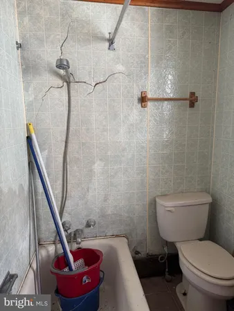 a workspace with furniture a window and a flat screen tv