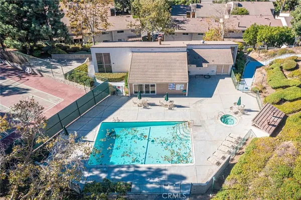 a view of a swimming pool with a patio
