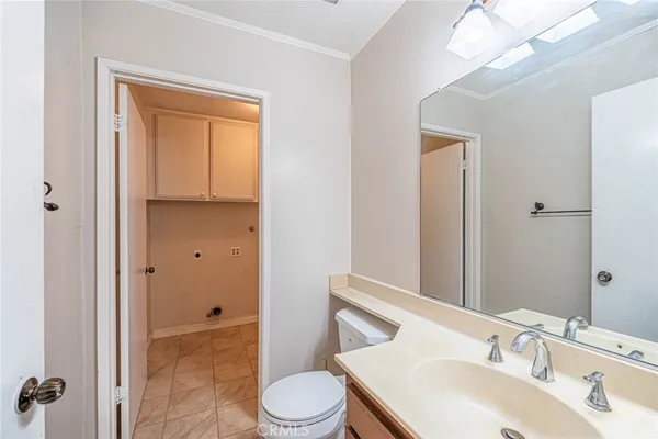 a view of small space with white cabinets