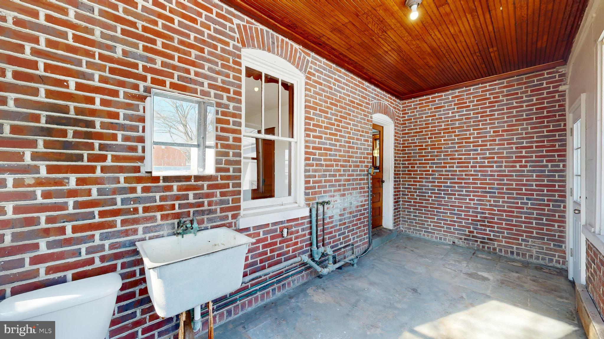 213 Broad Street St. Georges, DE 19733 - Photo 18 of 66 a view of a patio with a table and chairs
