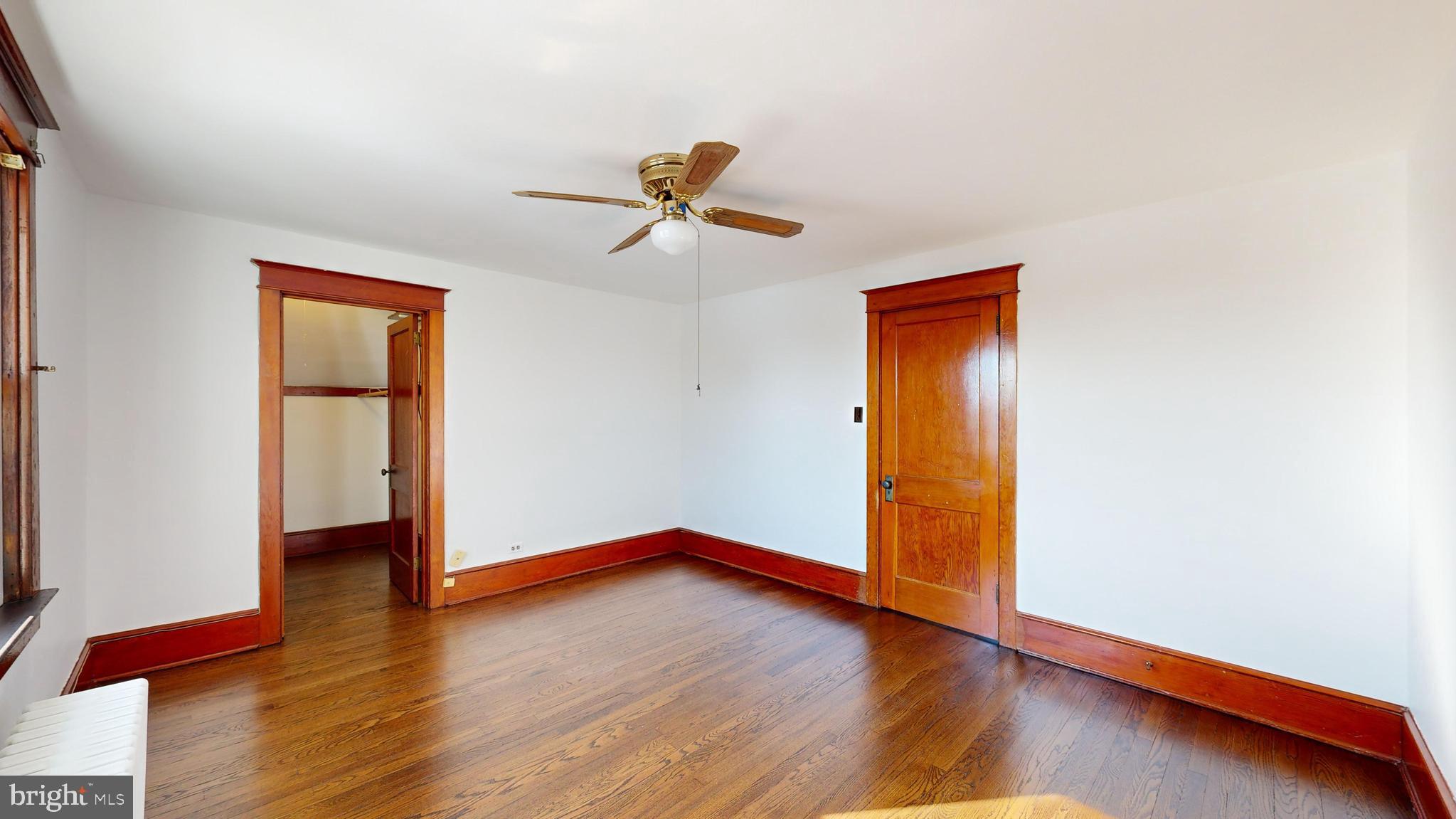 213 Broad Street St. Georges, DE 19733 - Photo 20 of 66 a view of an empty room with wooden floor