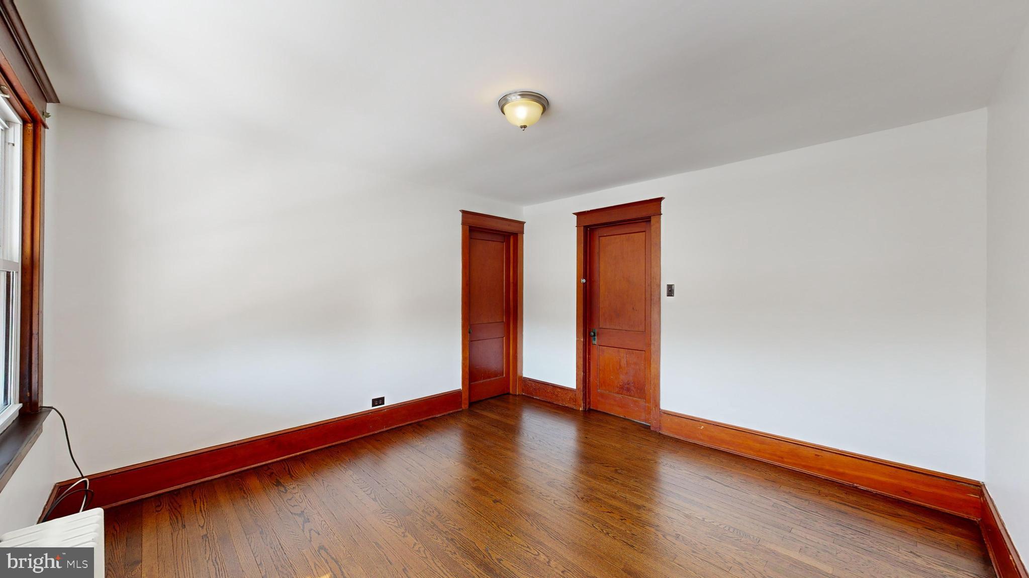 213 Broad Street St. Georges, DE 19733 - Photo 23 of 66 a view of an empty room and wooden floor