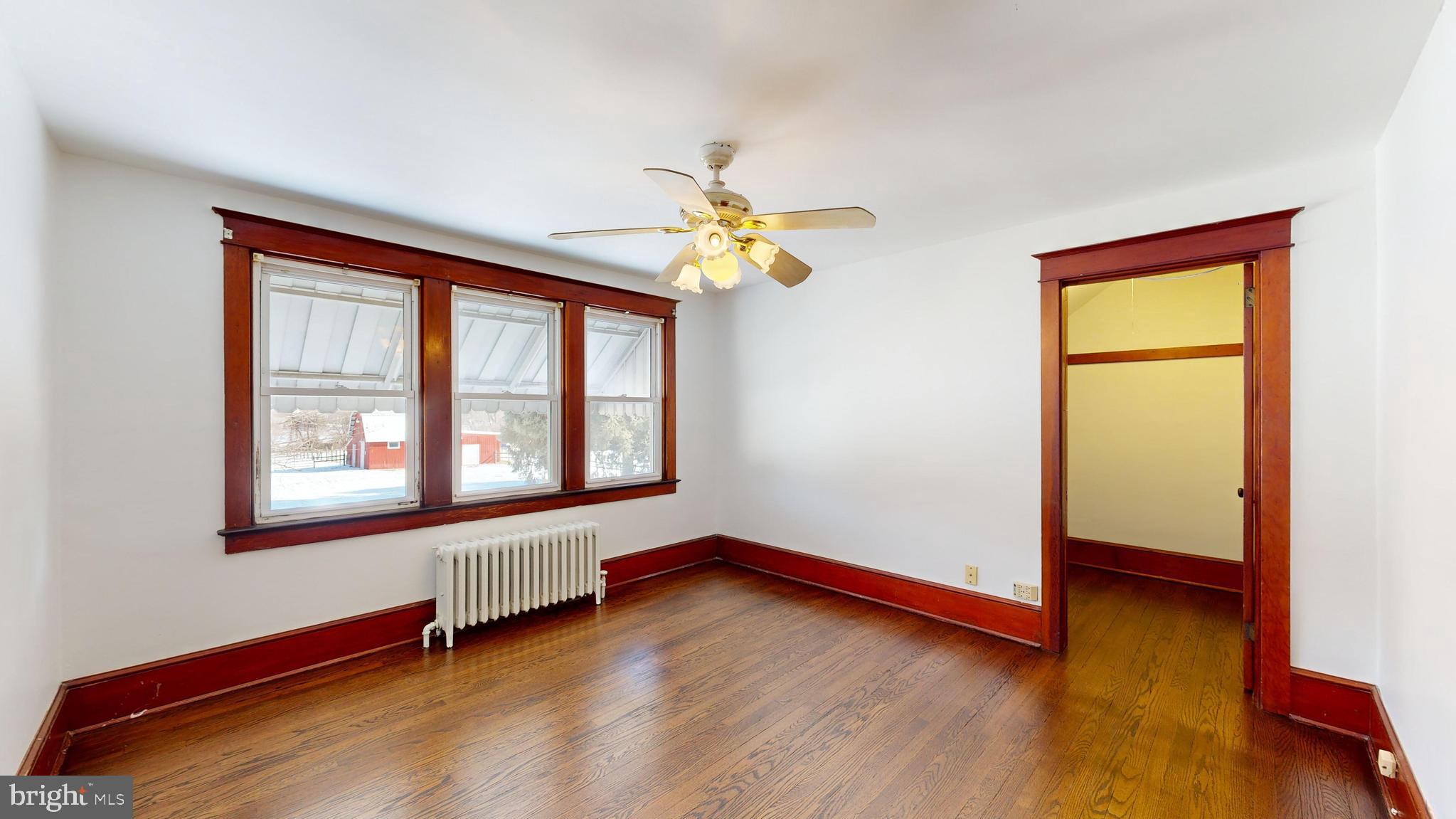 213 Broad Street St. Georges, DE 19733 - Photo 24 of 66 a view of room with window and wooden floor