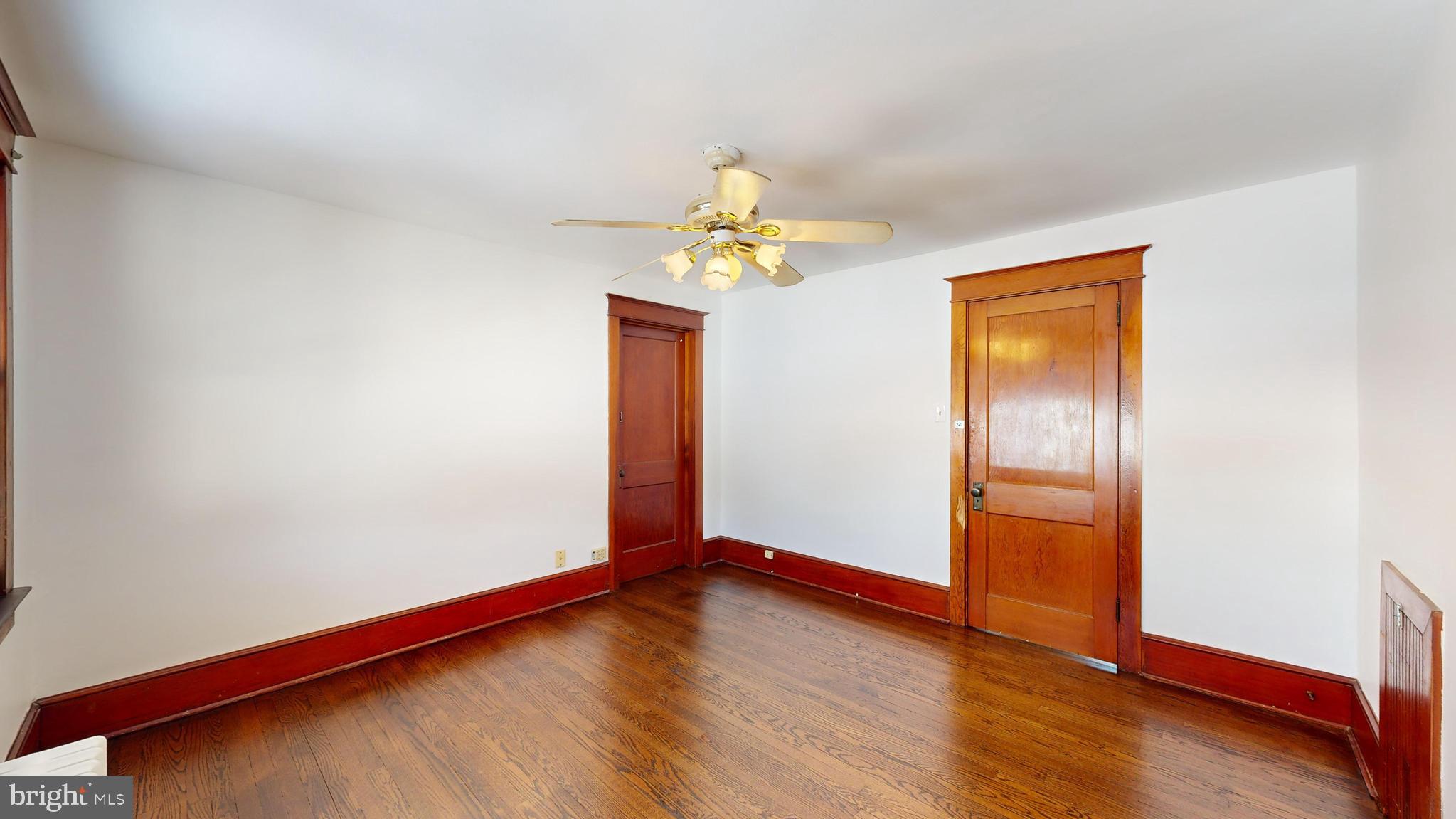213 Broad Street St. Georges, DE 19733 - Photo 25 of 66 a view of empty room with wooden floor