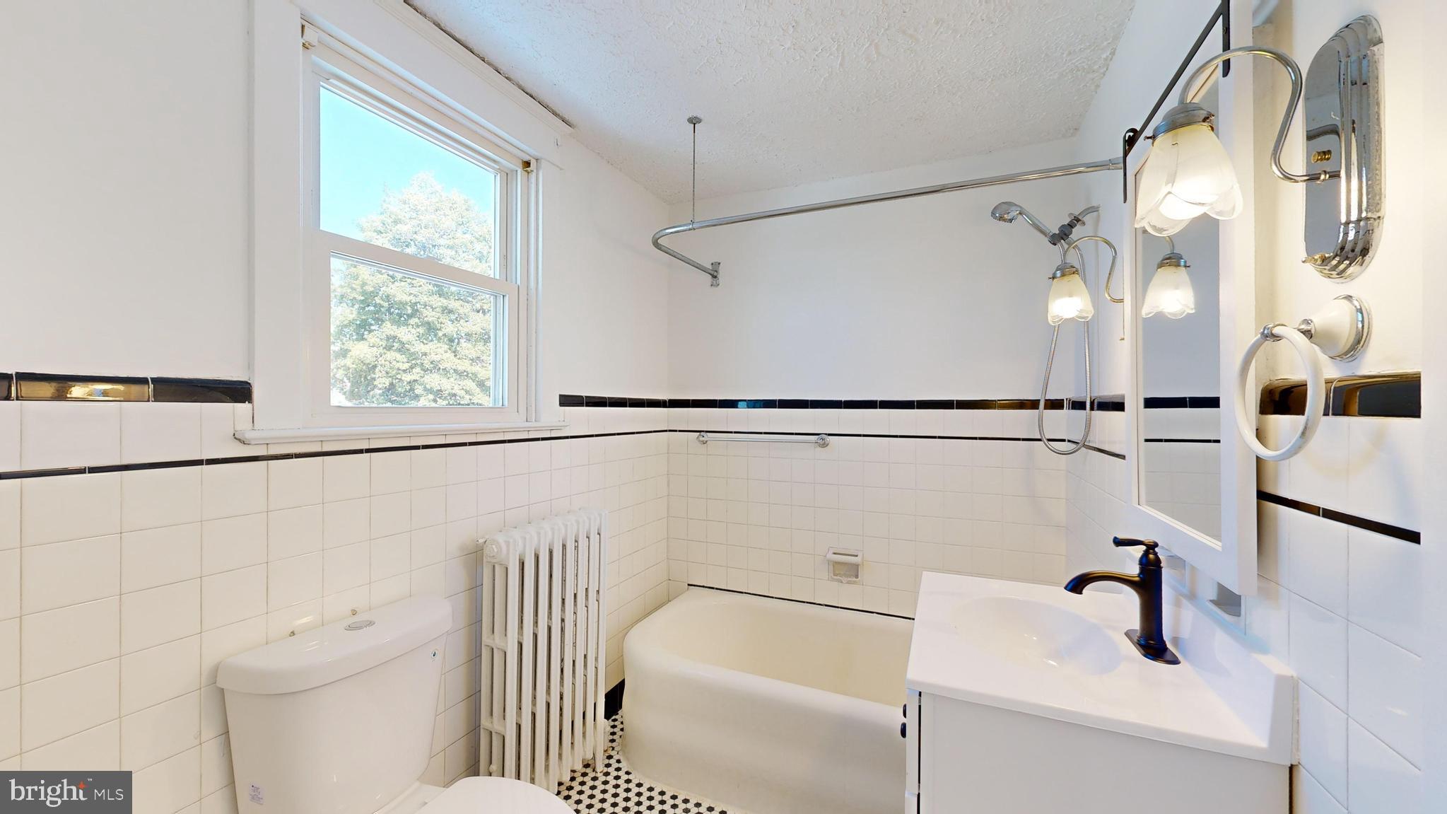 213 Broad Street St. Georges, DE 19733 - Photo 28 of 66 a bathroom with a sink and shower