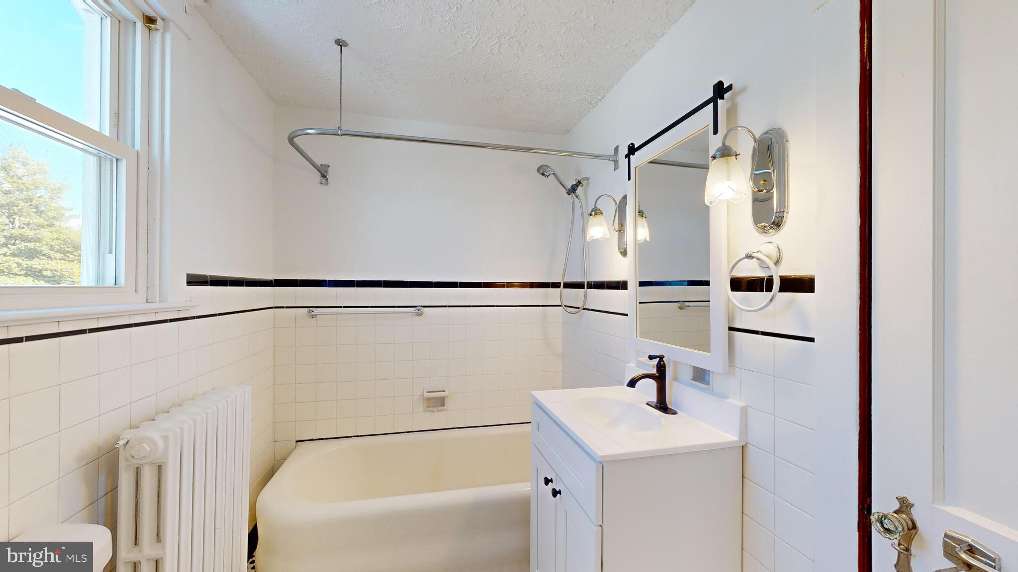 213 Broad Street St. Georges, DE 19733 - Photo 29 of 66 a bathroom with a sink a vanity and a mirror