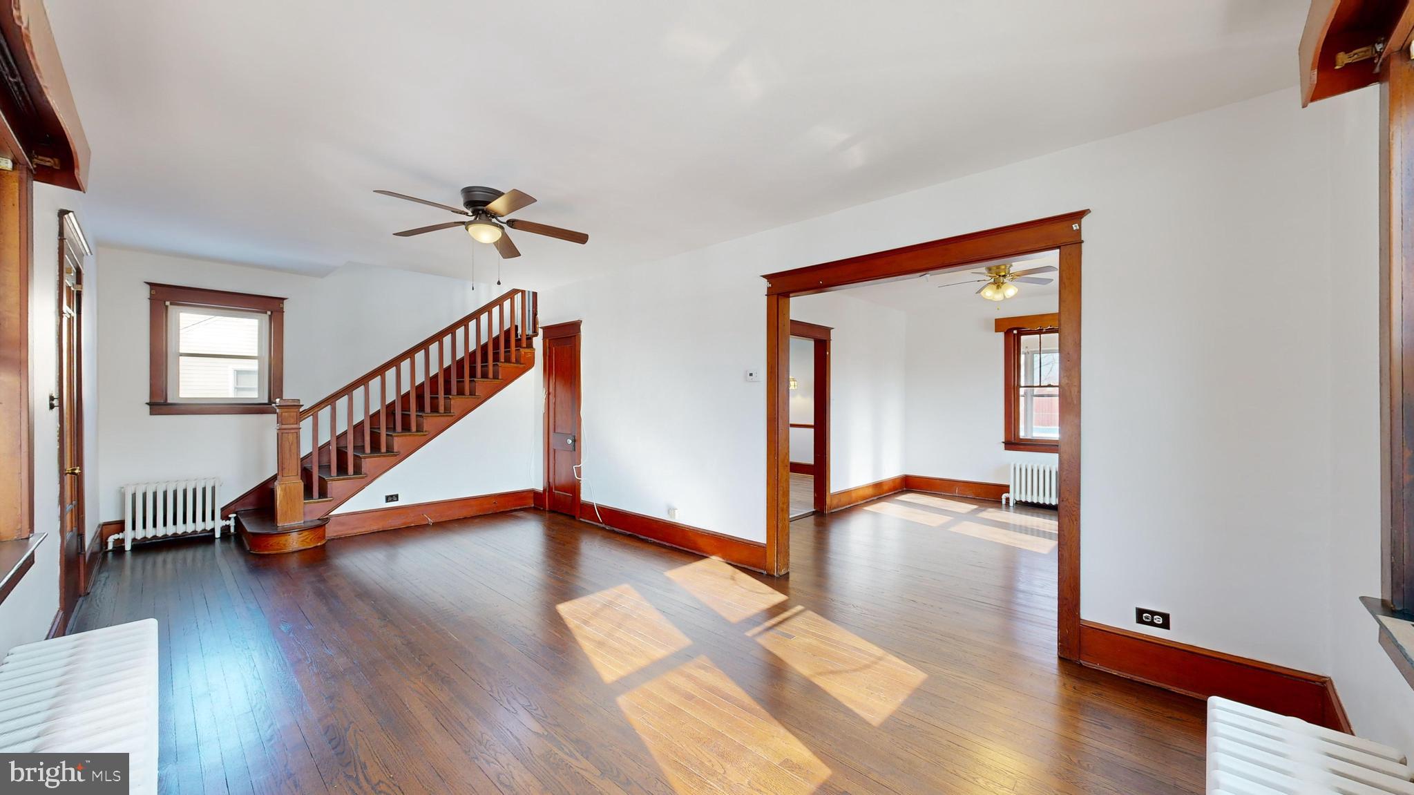 213 Broad Street St. Georges, DE 19733 - Photo 5 of 66 a view of an entryway with wooden floor and door