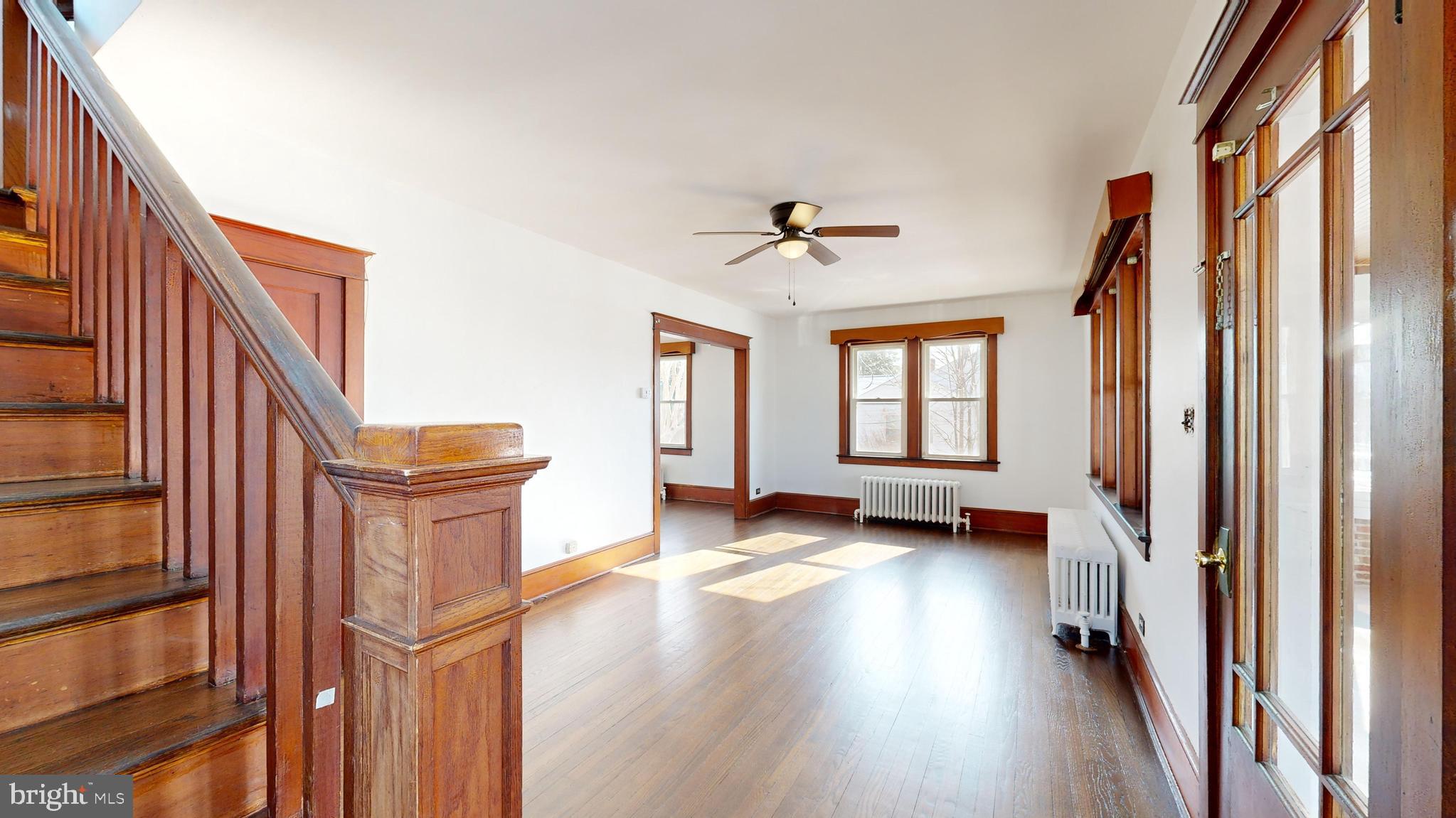 213 Broad Street St. Georges, DE 19733 - Photo 7 of 66 a view of an entryway with wooden floor and livingroom