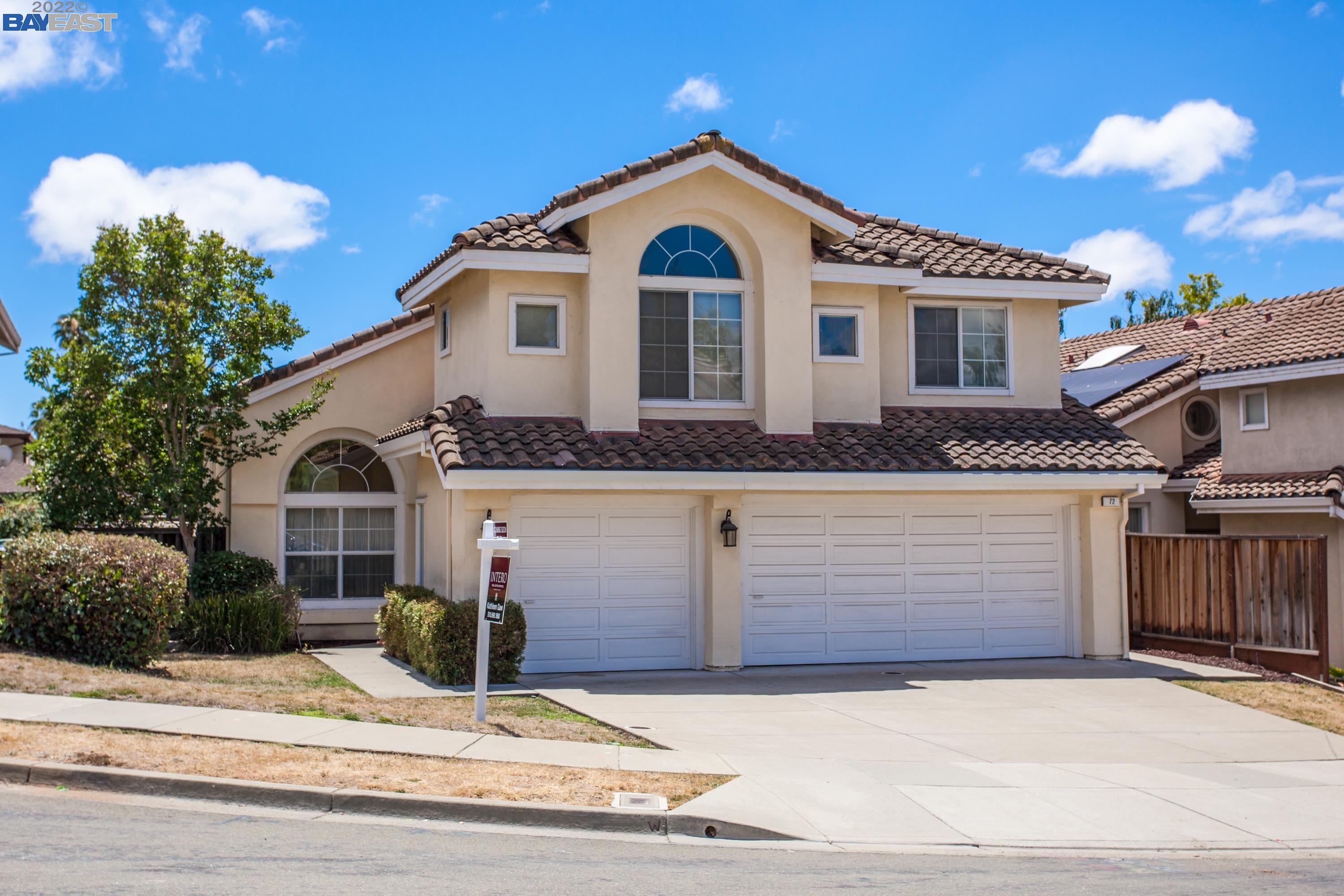 a front view of a house with a garage