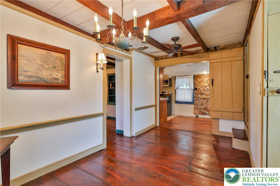 666 Point Phillips Road Bath, PA 18014 - Photo 29 of 68 Exposed wood beams and rich wood flooring create a rustic ambiance in this well-appointed living area.