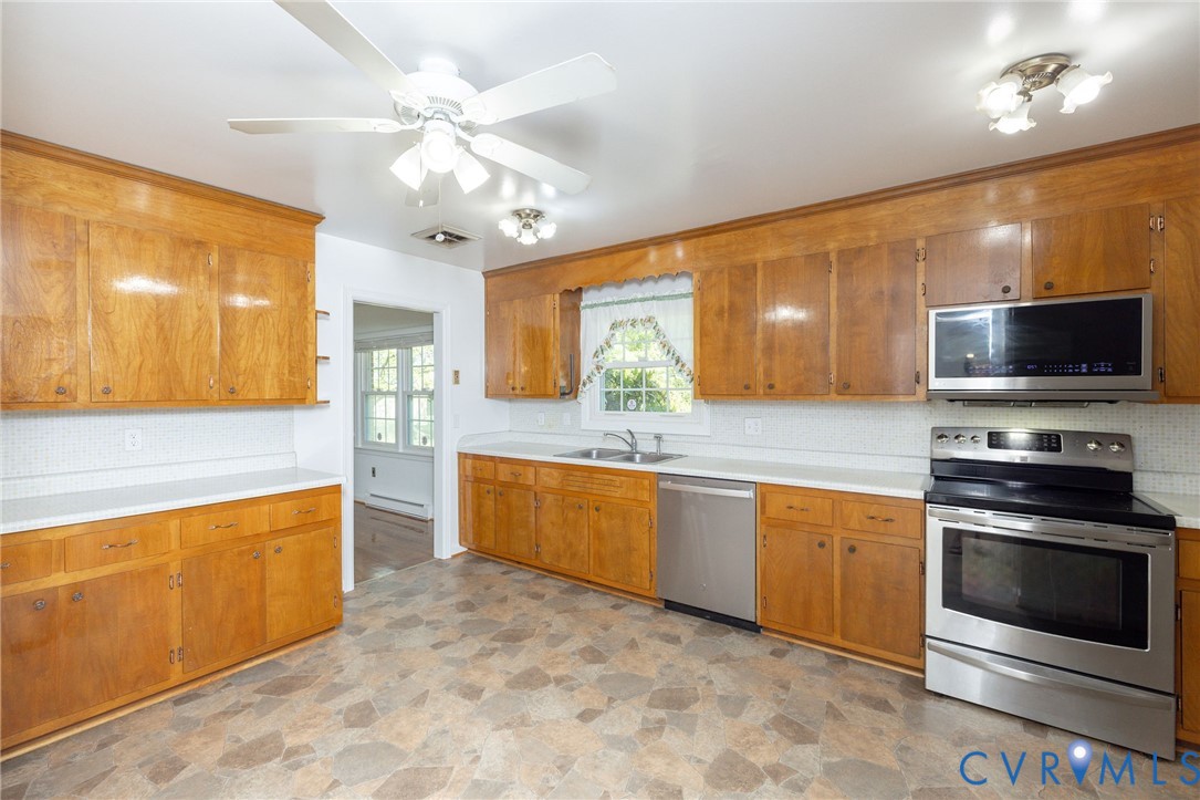 1210 Wellington Road Colonial Heights, VA 23834 - Photo 12 of 46 a large kitchen with stainless steel appliances granite countertop a stove and a sink