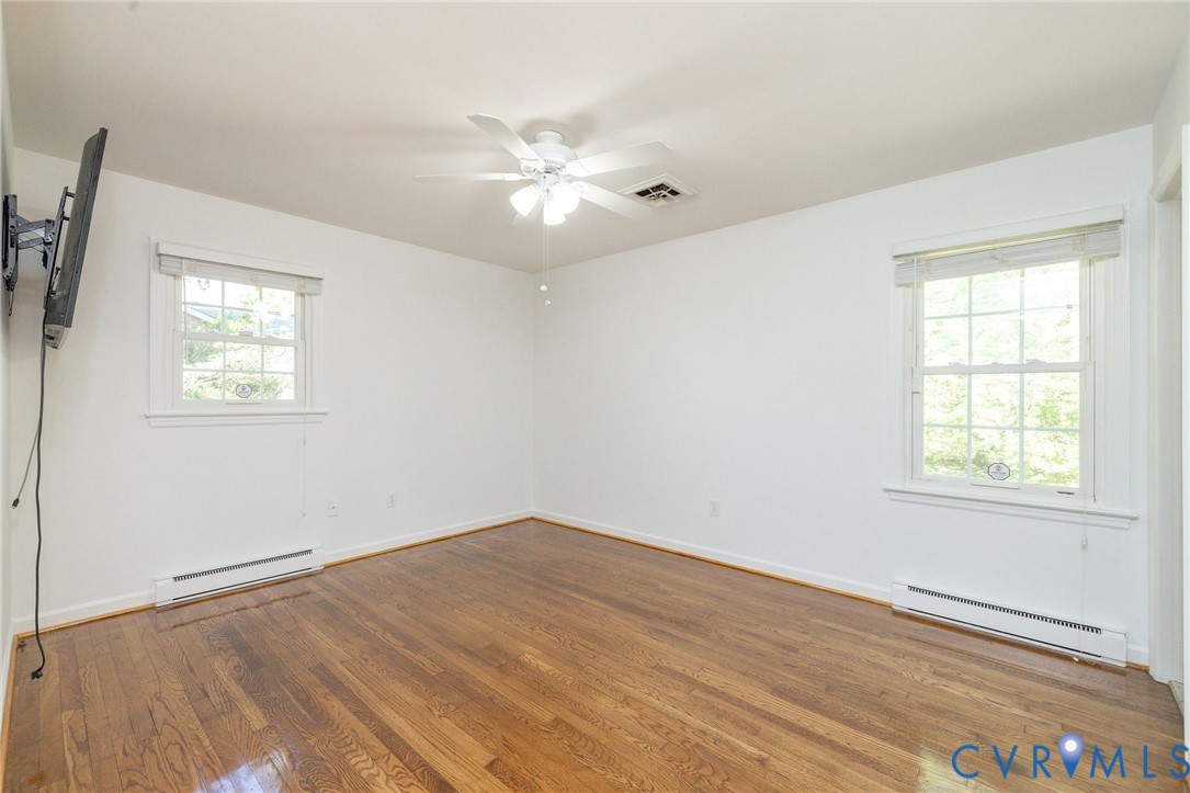 1210 Wellington Road Colonial Heights, VA 23834 - Photo 25 of 46 a view of an empty room with wooden floor and a window