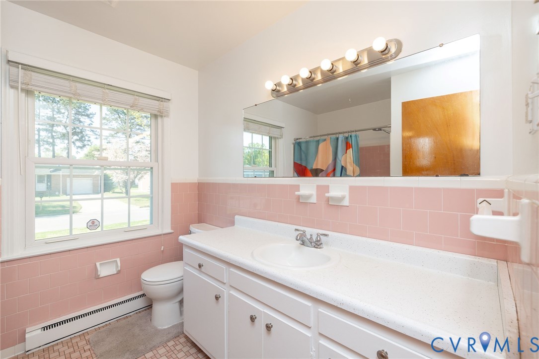 1210 Wellington Road Colonial Heights, VA 23834 - Photo 32 of 46 a bathroom with a sink a large mirror and a toilet