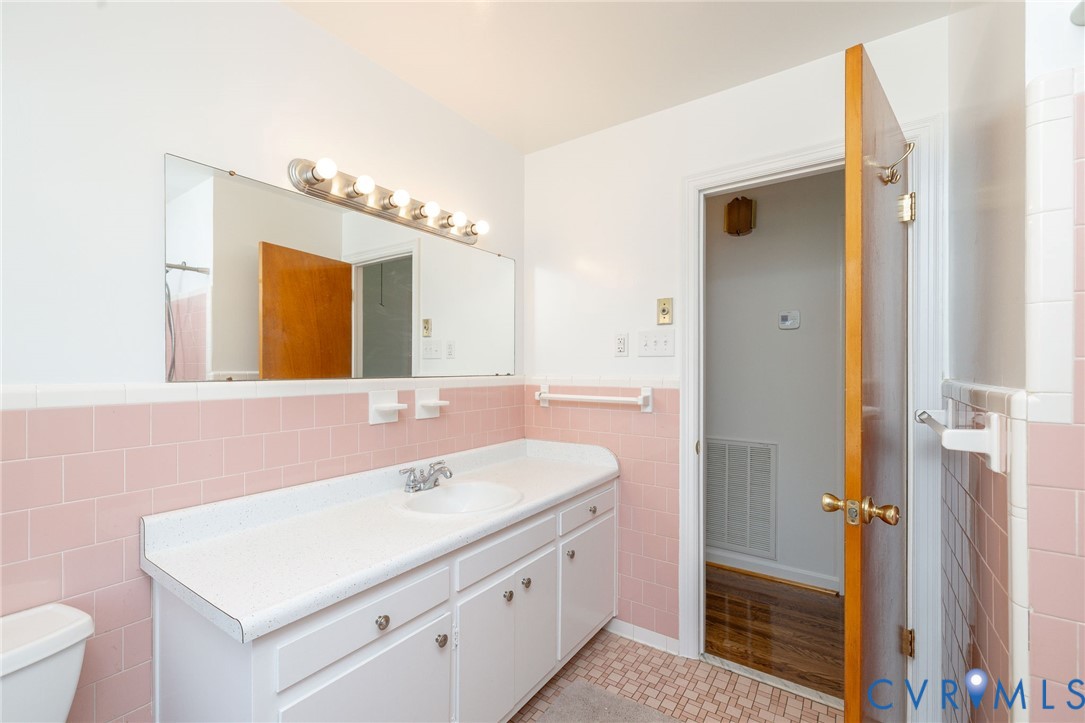 1210 Wellington Road Colonial Heights, VA 23834 - Photo 33 of 46 a bathroom with a sink and a mirror