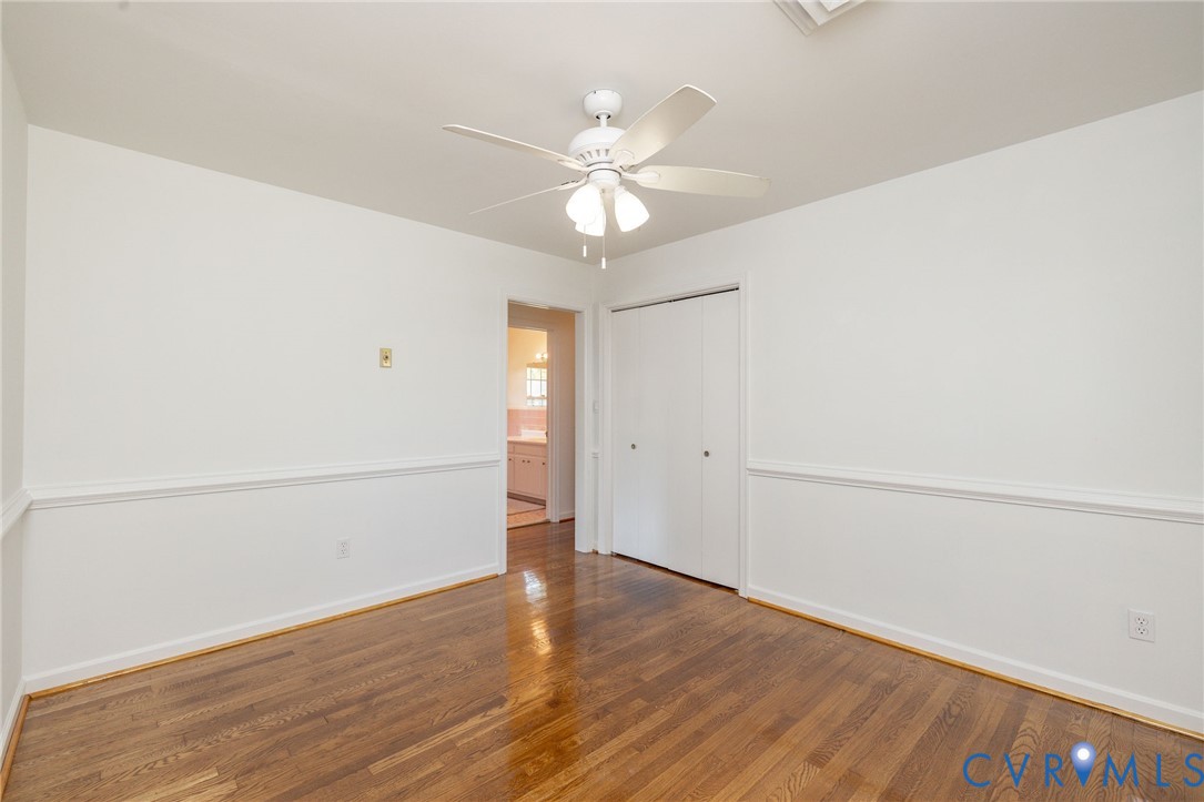 1210 Wellington Road Colonial Heights, VA 23834 - Photo 37 of 46 an empty room with wooden floor fan and windows