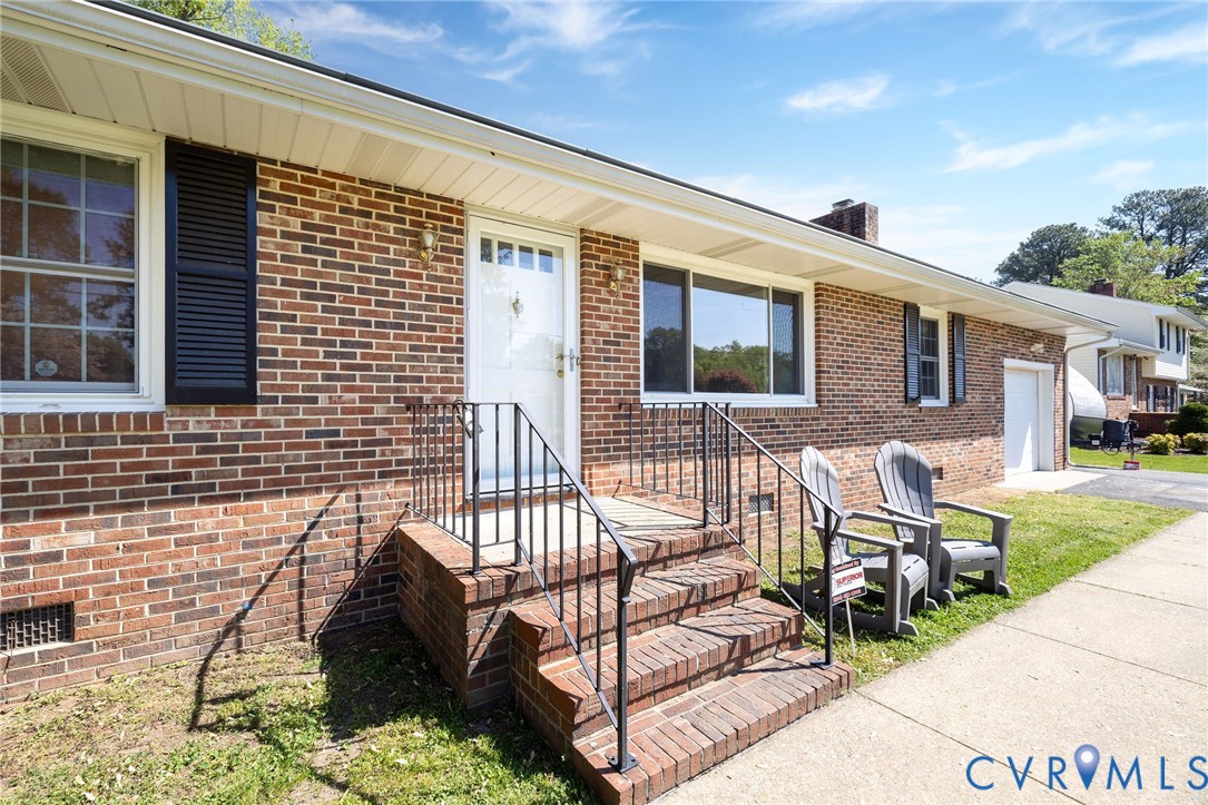 1210 Wellington Road Colonial Heights, VA 23834 - Photo 42 of 46 a view of a patio with chairs and table in patio