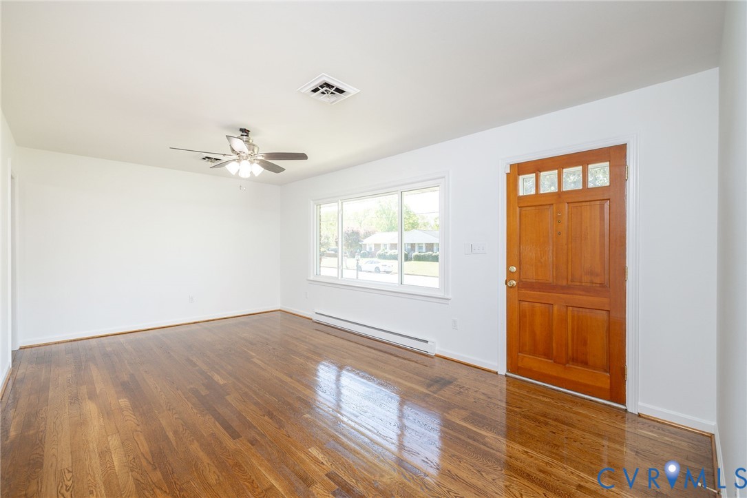 1210 Wellington Road Colonial Heights, VA 23834 - Photo 10 of 46 a view of an empty room with wooden floor and a window