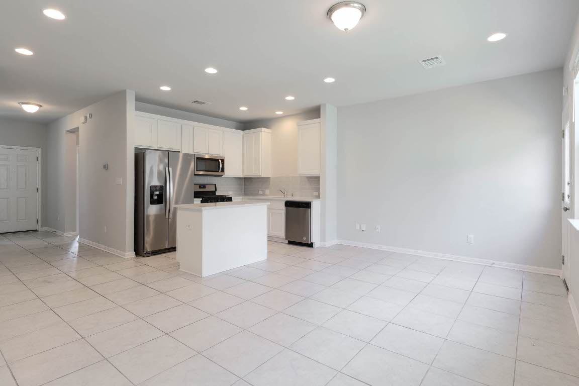 2020 Arendale Drive Leander, TX 78641 - Photo 12 of 22 a kitchen with stainless steel appliances a refrigerator sink and microwave