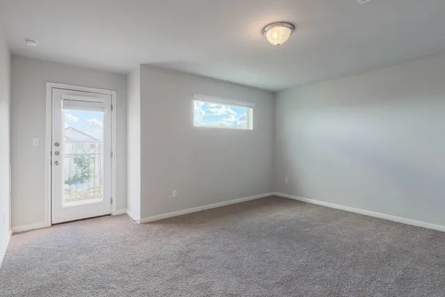 a view of an empty room and closet area