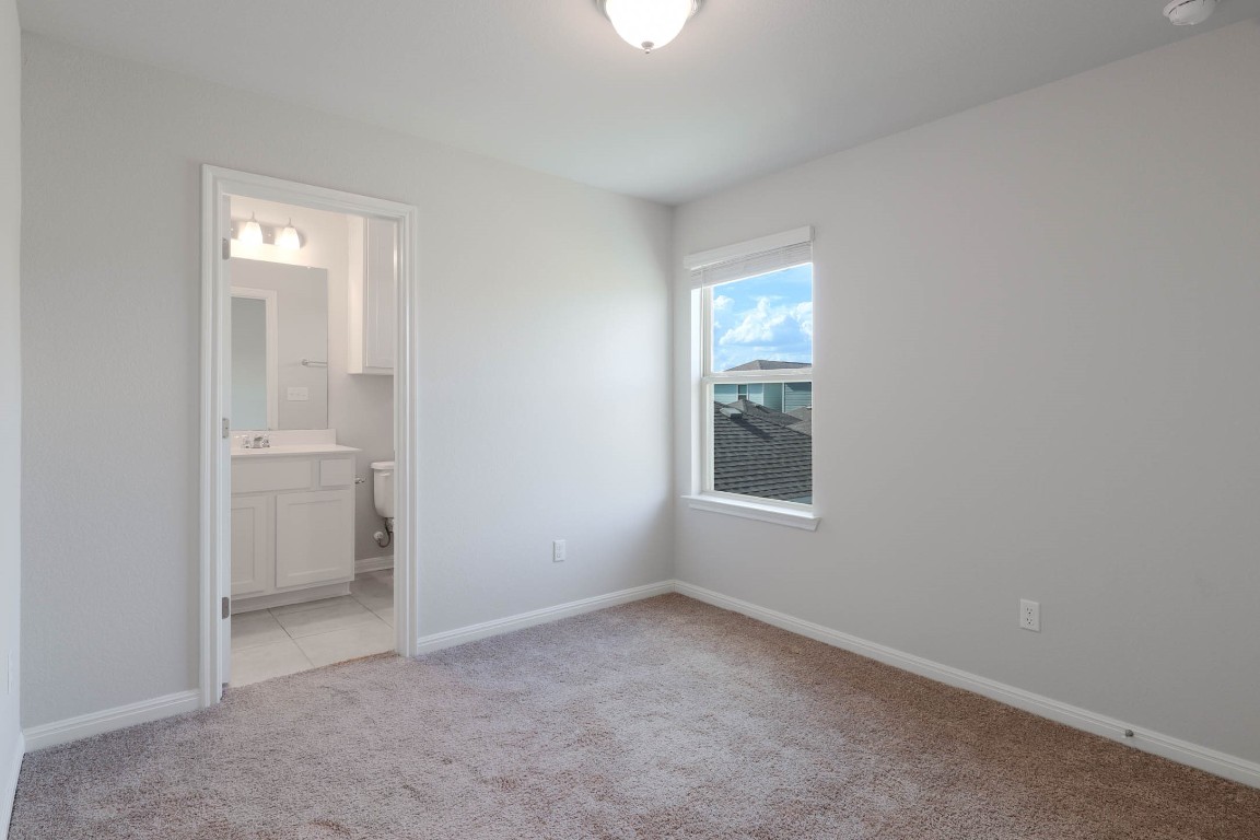 2020 Arendale Drive Leander, TX 78641 - Photo 19 of 22 an empty room with a bathroom and a window