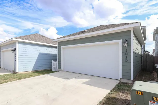 a view of garage with wooden door