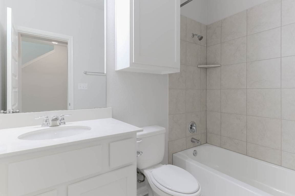 2020 Arendale Drive Leander, TX 78641 - Photo 9 of 22 a bathroom with a sink toilet and bathtub