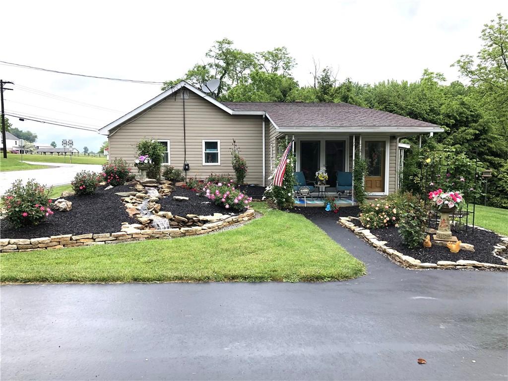 1092 Old State Road New Castle, PA 16101 - Photo 2 of 12 a view of a house with patio