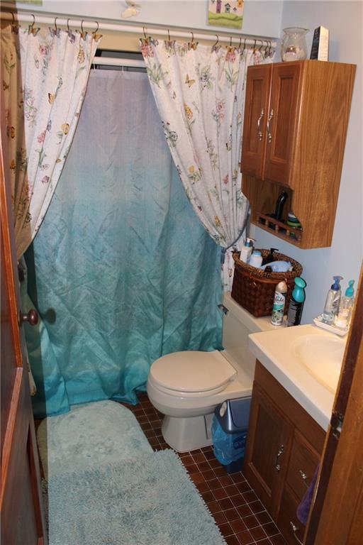 1092 Old State Road New Castle, PA 16101 - Photo 11 of 12 a bathroom with a toilet and a shower curtain