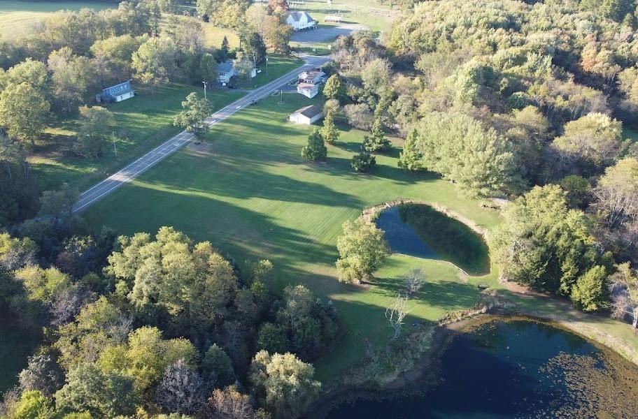 1092 Old State Road New Castle, PA 16101 - Photo 3 of 12 a view of a lake from a yard