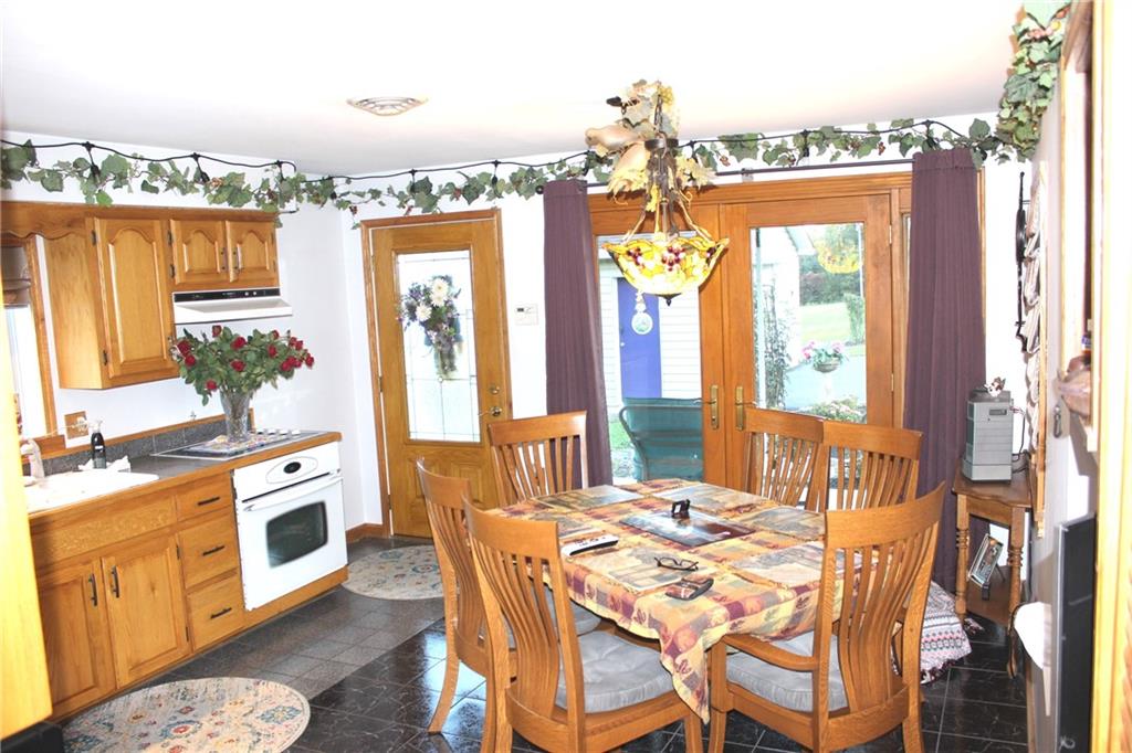 1092 Old State Road New Castle, PA 16101 - Photo 7 of 12 a view of a dining room with furniture a chandelier and wooden floor