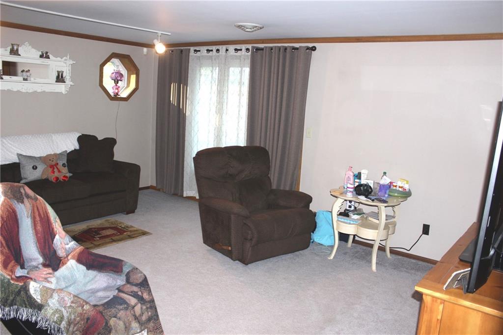 1092 Old State Road New Castle, PA 16101 - Photo 8 of 12 a living room with furniture and a window