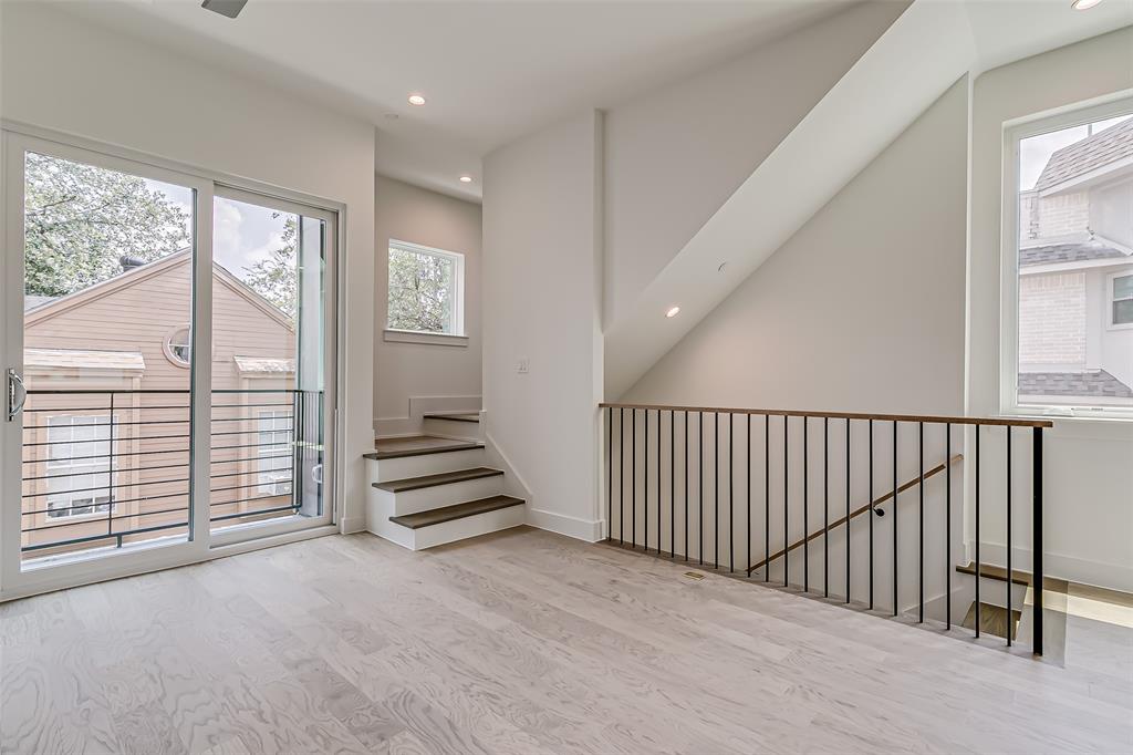 6028 Lewis Street, Unit 204 Dallas, TX 75206 - Photo 17 of 39 a view of a hallway with stairs